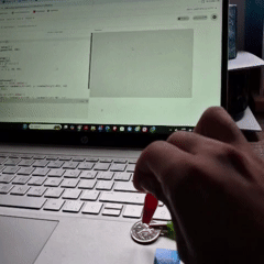 Tapping the coin connected to the SPACEBAR on the Makey Makey generates green squares at random positions across the screen.