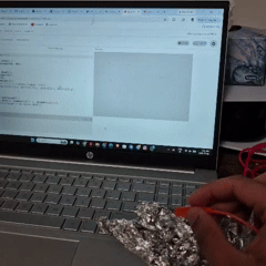 Tapping the tin foil connected to the SPACEBAR on the Makey Makey creates continuous black lines that connect from the previous point, forming evolving shapes.